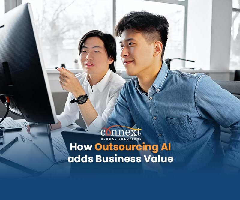 How-Outsourcing-AI-adds-Business-Value-artificial-tech-developers-inside-office-looking-at-computer-main