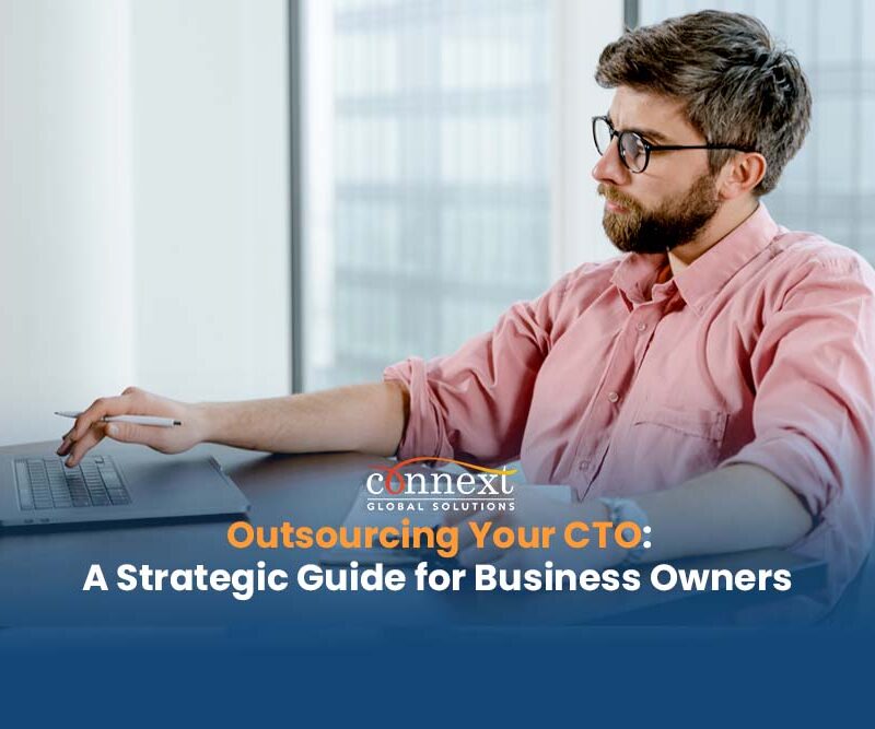 Outsourcing-Your-CTO-A-Strategic-Guide-for-Business-Owners-man-in-corporate-attire-using-laptop-in-office