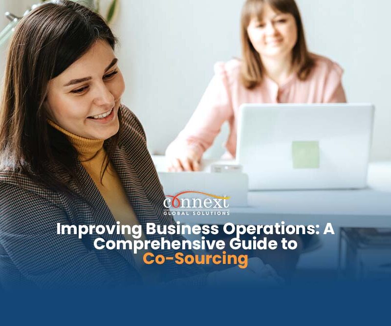 Improving-Business-Operations-A-Comprehensive-Guide-to-Co-Sourcing-women-in-corporate-attire-in-office-using-laptops