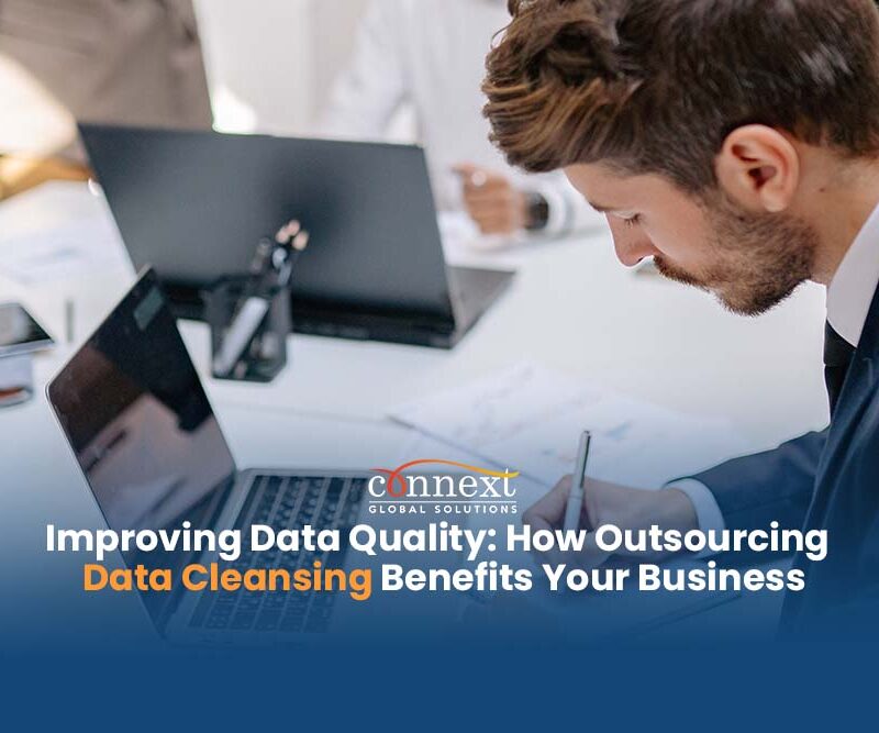Improving-Data-Quality-How-Outsourcing-Data-Cleansing-Benefits-Your-Business-caucasian-man-in-corporate-suit-attire-using-laptop-in-office