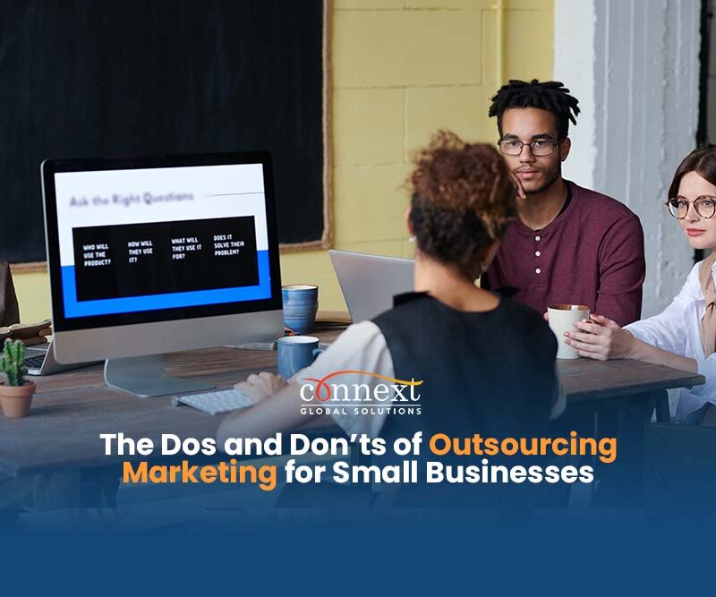 men-and-women-in-corporate-attire-in-a-team-meeting-using-laptop-in-office-desktop