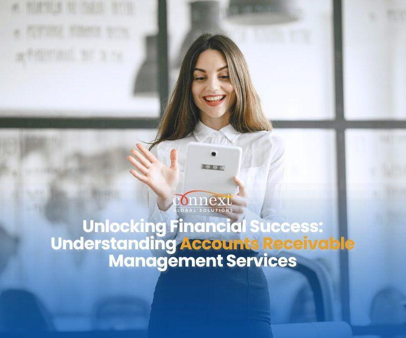 Unlocking-Financial-Success-Understanding-Accounts-Receivable-Management-Services-woman-in-corporate-attire-in-a-happy-mood-holding-tablet-in-office