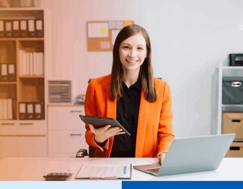 business woman using tablet and laptop for doing math finance on an office desk, tax