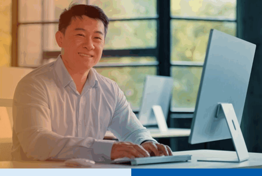 Mature-asian-businessman-chinese-korean-japanese-office-working-using-desktopÂ