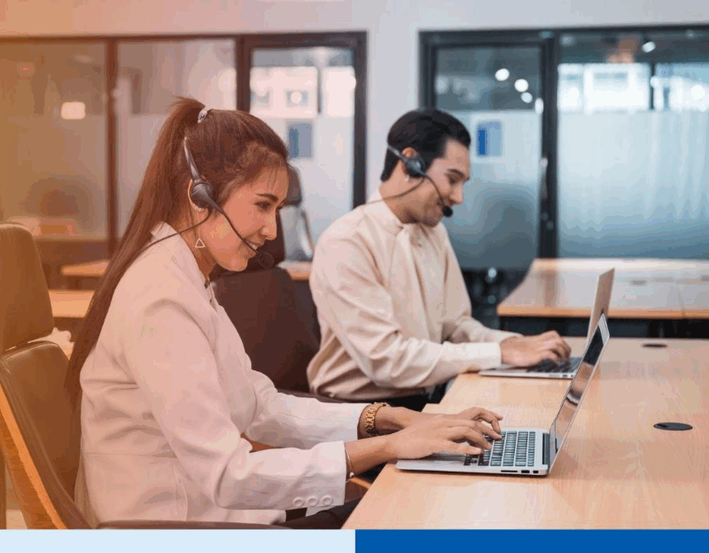 Operator asian woman agent with headset working with laptop on customer consultation in the office 