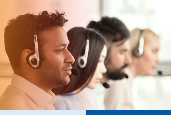 Group of call center agents making calls and working on their computers